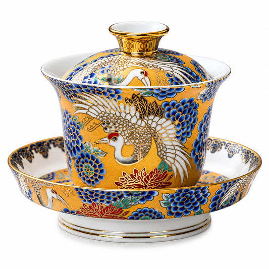 Golden Crane 180 mL ceramic enamel gaiwan with white cranes, blue floral motifs, gold detail, lid and matching saucer