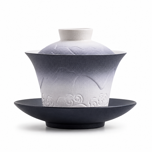 Mountains and Sea 120 mL Dehua gaiwan with white-to-deep-blue gradient glaze, mountain relief, lid, bowl and saucer